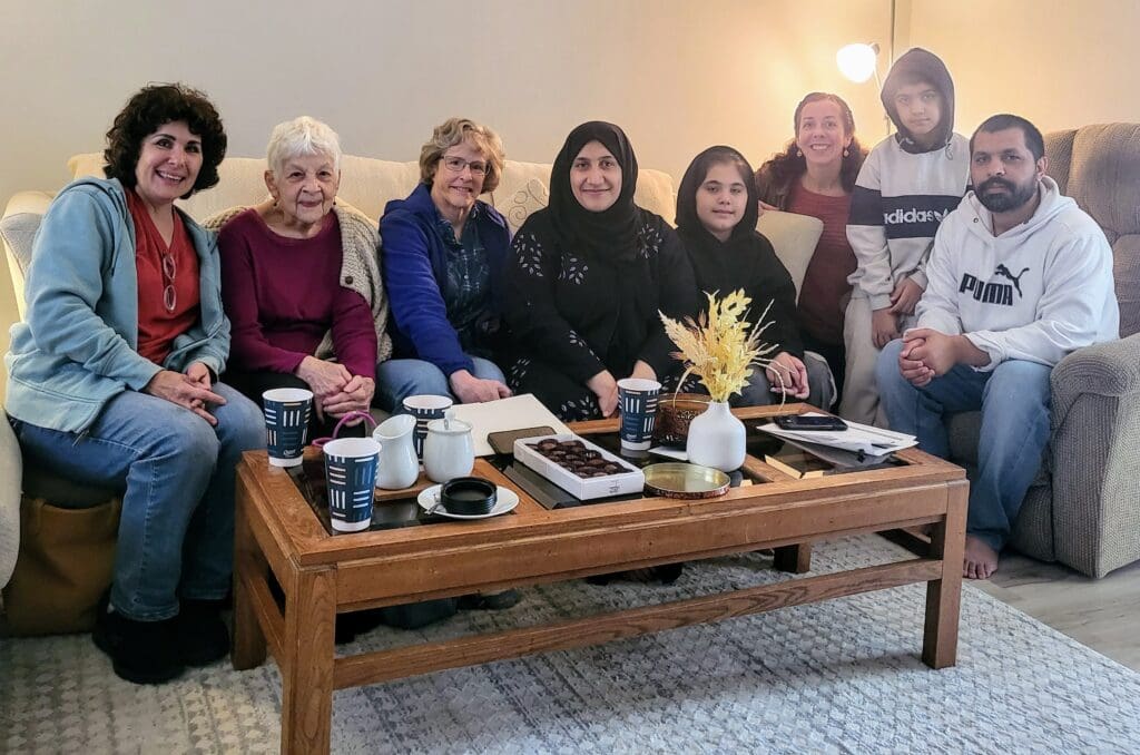 The family and their sponsors in their new home in Champaign, IL 