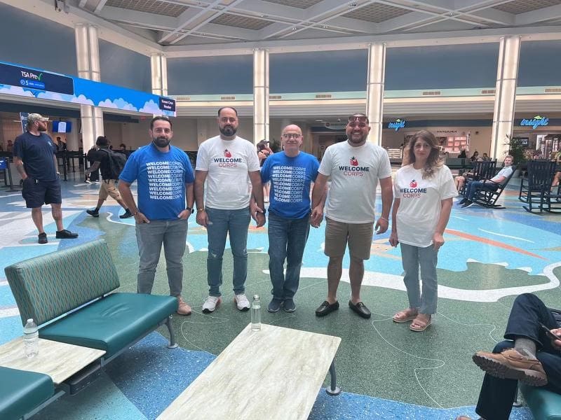 The Karkokle Sponsor Group at the airport. From left to right: Muntasser (center) is joined by his sons in law Samer and Salam (left), his nephew Ayden, and his wife Taghreed (right) elp, he was able to get a driver's license, sign up for English classes, and even secure his first job in the United States. They also had fun along the way, going on hikes, attending baseball games, and sightseeing